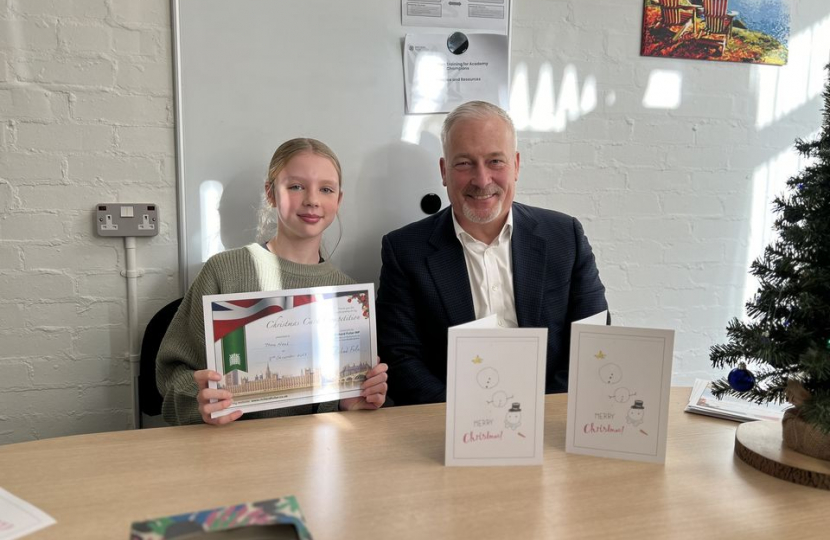 Richard with Thea Neal, winner of his 2023 Christmas Card competition at Oakley Primary Academy