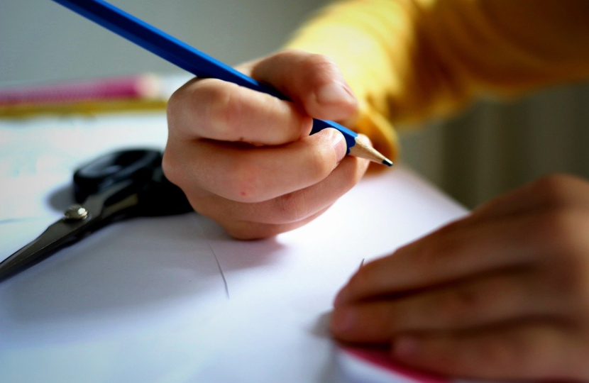 Child writing in school