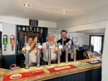 Richard behind the bar of the the newly refurbished Queen's Head in Sandy