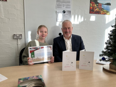 Richard with Thea Neal, winner of his 2023 Christmas Card competition at Oakley Primary Academy